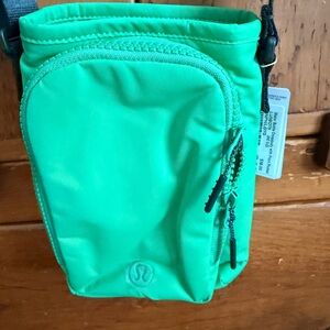 Lululemon Athletica Vibrant Green Crossbody water bottle bag.